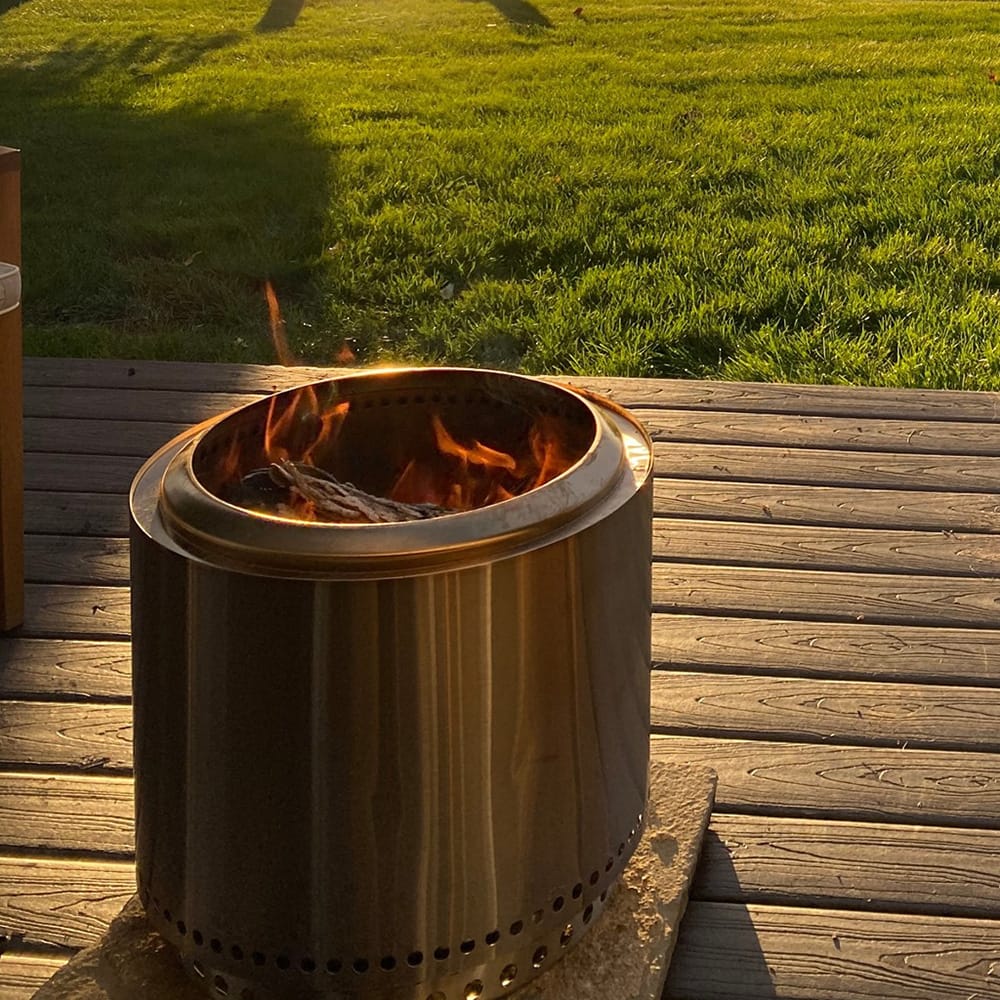 KZ-S cylindrical smokeless fire pit burning on outdoor deck — classic design, 304 stainless steel
