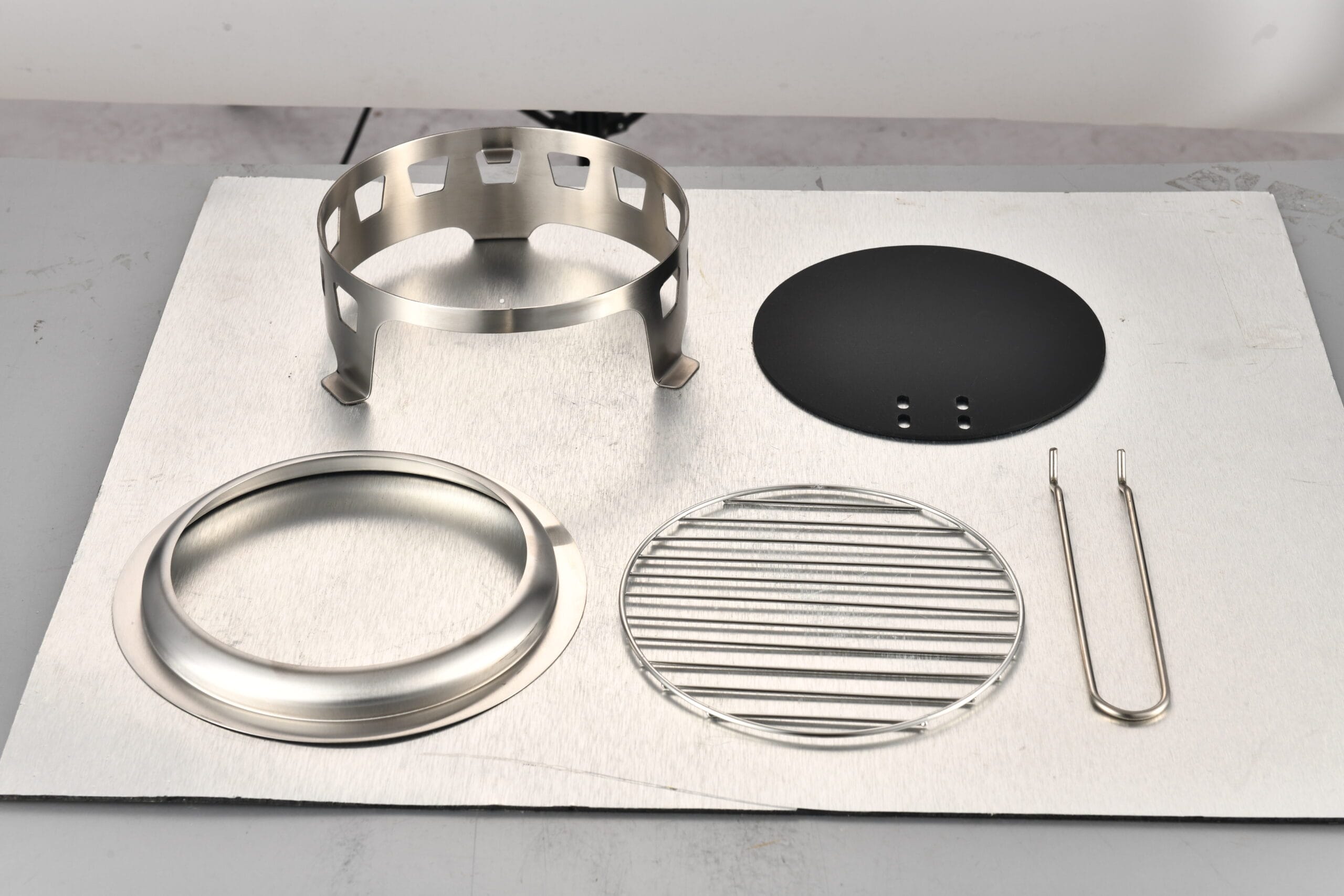 KZ-X220 smokeless fire pit standard accessories – elevated stand, deflector ring, cooking plate, grill rack, fire poker