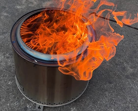 Smokeless fire pit producing tall flames — double-wall secondary combustion in action