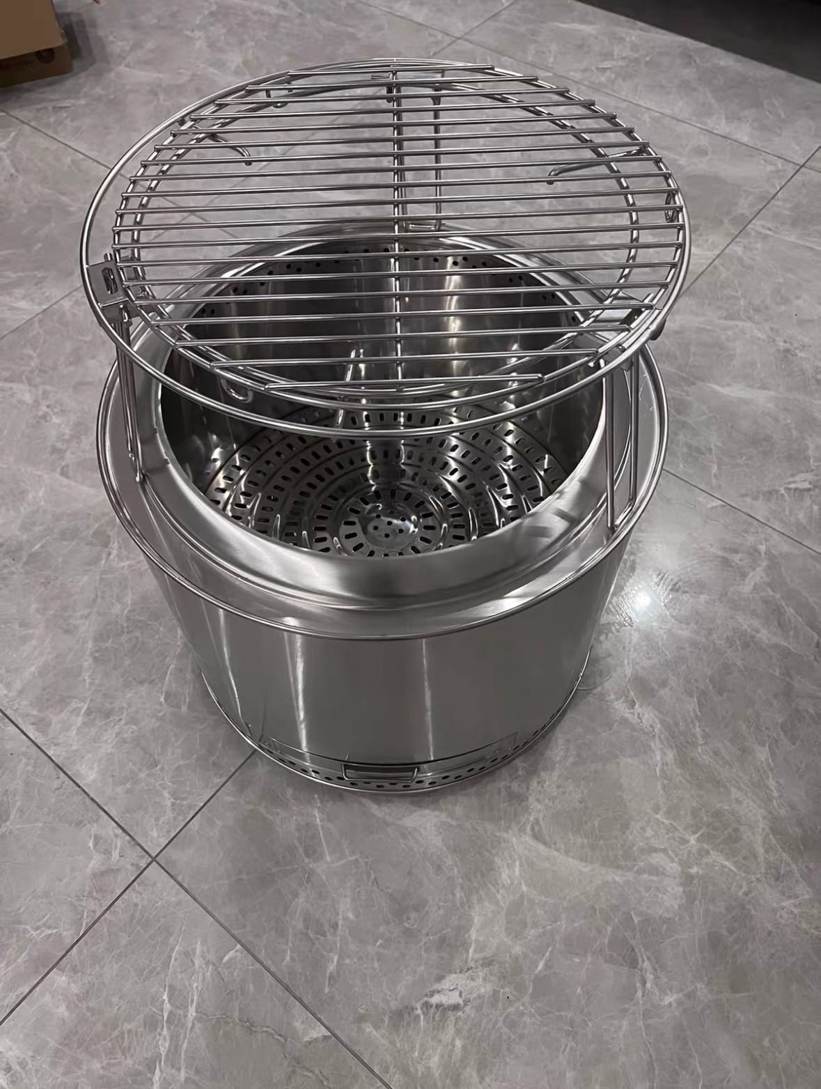 Double wall fire pit design explained featuring a stainless steel smokeless fire pit with removable cooking grill and secondary combustion system